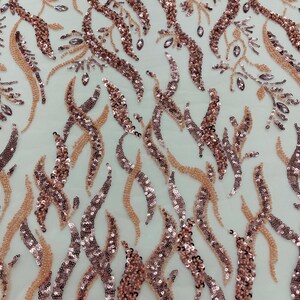 Blush pink Vine Design Embroider and heavy beading on a mesh lace-sold by the yard.