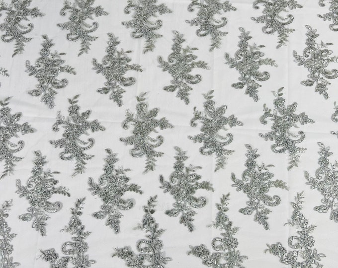 Silver Lex floral design corded and embroider with sequins on a mesh lace fabric-prom-sold by the yard.