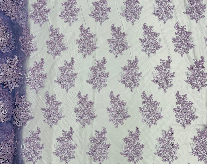 Lilac corded embroider flowers with sequins on a mesh lace fabric-prom-sold by the yard.