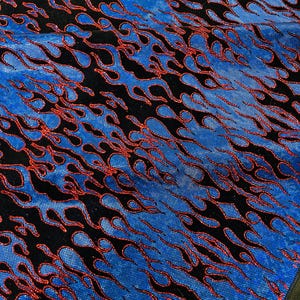 May include: Blue and red flame pattern fabric with a glittery finish. The fabric is black with blue and red flames.