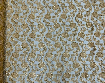 Gold corded flowers embroider with sequins on a mesh lace fabric-prom-sold by the yard.