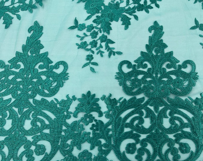 Teal Green flowers flat lace embroider on a 2 way stretch mesh sold by the yard.