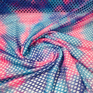 Hot Pink/Lilac big fishnet diamond mesh tie dye with silver glitter 4 way stretch 58/60 inches wide. Sold by the yard.