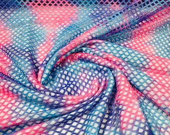 Hot Pink/Lilac big fishnet diamond mesh tie dye with silver glitter 4 way stretch 58/60 inches wide. Sold by the yard.
