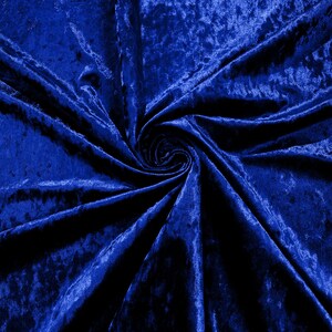 May include: A close-up of a deep blue velvet fabric with a swirling pattern. The fabric is soft and luxurious, with a subtle sheen.
