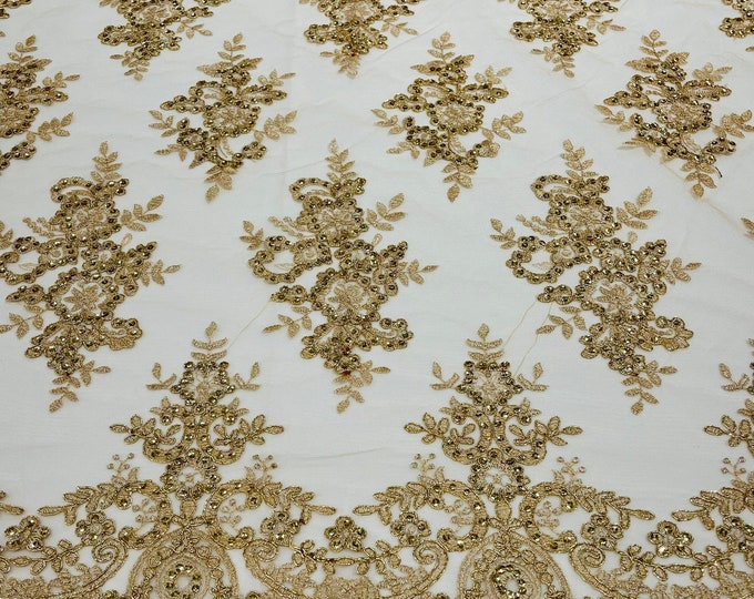 Gold metallic corded flowers embroider with sequins on a mesh lace fabric-sold by the yard.