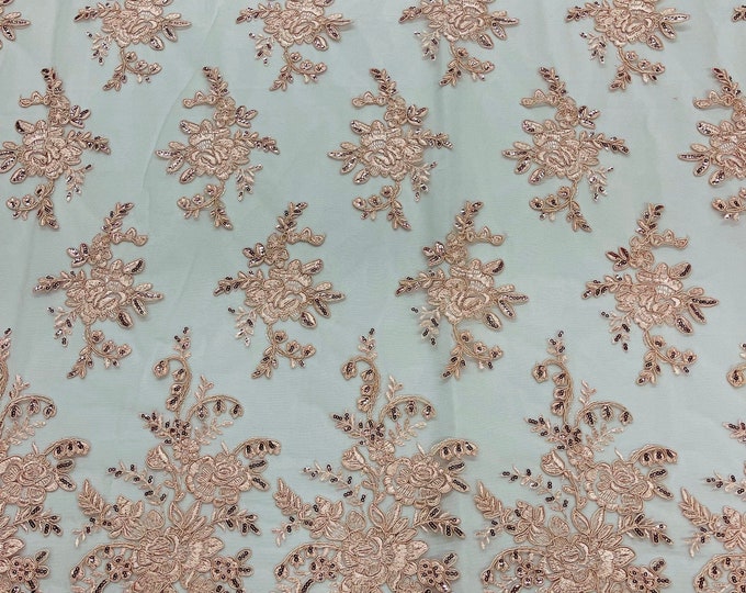 Blush pink flower lace corded and embroider with sequins on a mesh-Sold by the yard.