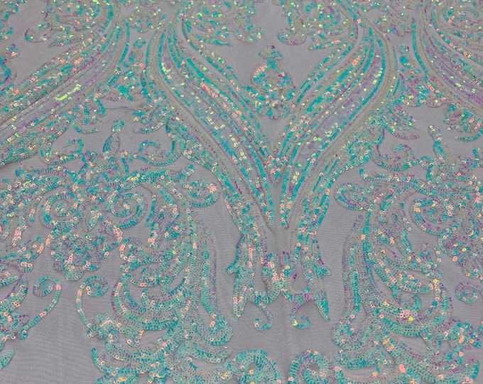 Aqua Blue Iridescent shiny sequin damask design on a white 4 way stretch mesh-sold by the yard.