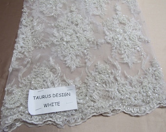 Gorgeous white French design embroider and beaded on a mesh lace. Wedding/Bridal/Prom/Nightgown fabric.