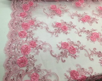 Pink 3d flowers embroider with sequins on a pink mesh lace. Wedding/bridal/prom/ nightgown fabric. Sold by the yard.