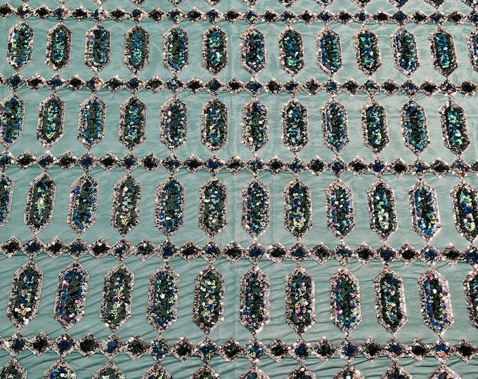 Green/Blue iridescent Jewel sequin design on a green 4 way stretch mesh fabric -sold by the yard.