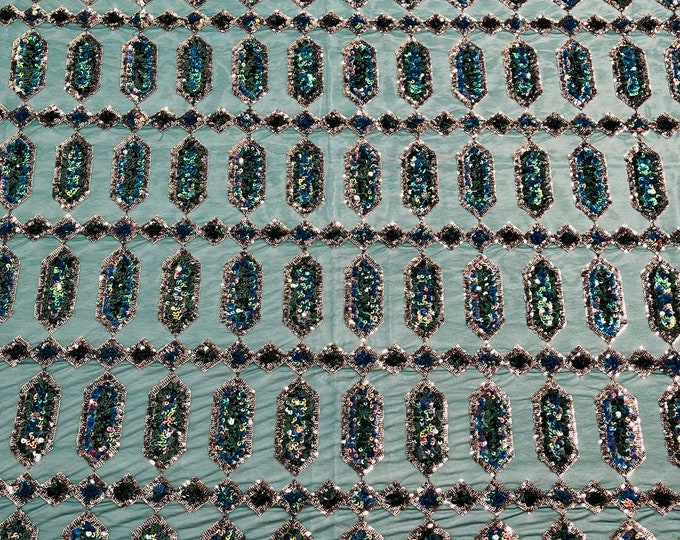 Green/Blue iridescent Jewel sequin design on a green 4 way stretch mesh fabric -sold by the yard.