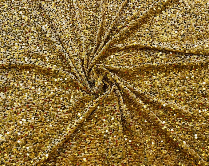 Gold economic all over shiny sequins on a 2 way stretch velvet , sold by the yard.