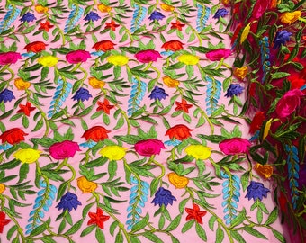 Maria multi color Mexican Sarape floral design embroider on a Fuchsia mesh lace-sold by the yard.