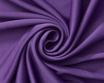 Tejido de punto interlock morado, poliéster y elastano con elasticidad mecánica.
