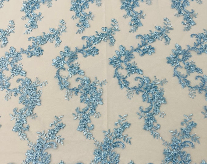 Light blue flower lace corded and embroider with sequins on a mesh-Sold by the yard.