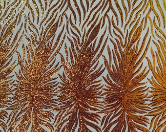 Orange iridescent phoenix feather design with sequins embroider on a Nude 4 way stretch mesh fabric-sold by the yard.