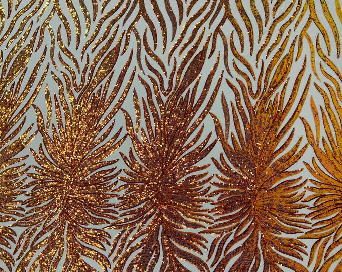 Orange iridescent phoenix feather design with sequins embroider on a Nude 4 way stretch mesh fabric-sold by the yard.
