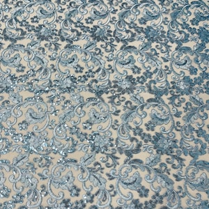 Light blue metallic corded embroider flowers with sequins on a mesh lace fabric-prom-sold by the yard.
