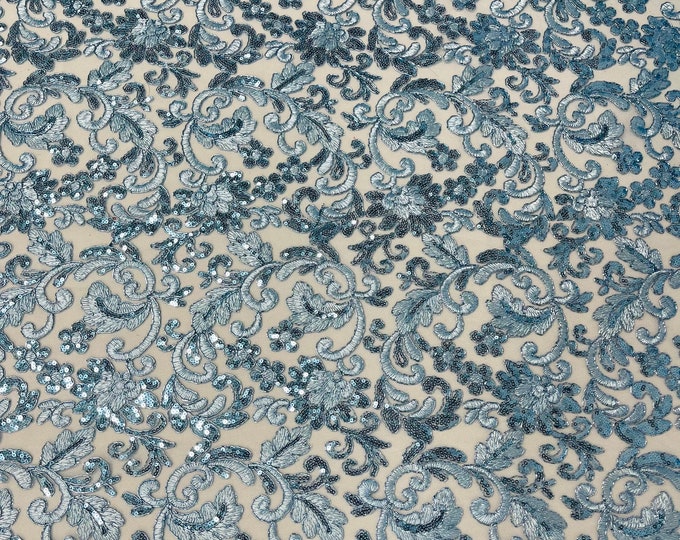 Light blue metallic corded embroider flowers with sequins on a mesh lace fabric-prom-sold by the yard.