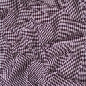 May include: Close-up of a fabric with a burgundy and white gingham pattern. The fabric is wrinkled, creating shadows and texture. The pattern is a classic, small-scale check, suitable for various sewing projects.