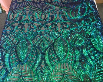 Green royalty iridescent sequins on a 4 way Stretch black mesh lace-dresses-apparel-fashion-prom-nightgown-sold by the yard.