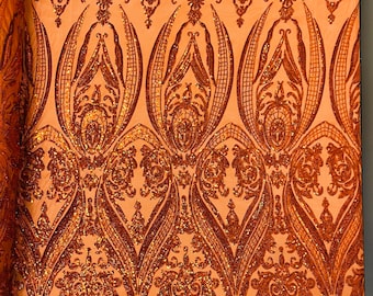 Burnt Orange iridescent empire damask design with sequins embroider on a 4 way stretch mesh fabric-sold by the yard.