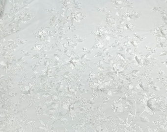 White Emily 3d floral design embroider with pearls in a mesh lace-sold by the yard.
