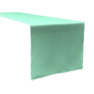 May include: A light green table runner. The runner is made of a smooth, silky fabric and has a subtle sheen.