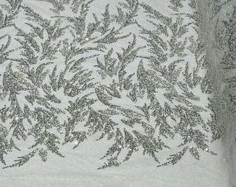 Silver/White elegant hand beaded design embroider on a glitter mesh lace-prom-sold by the yard.