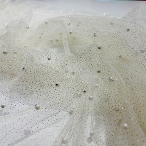 Ivory Scattered Pearls Studded with gold glitter Mesh, 2-Way Stretch, sold by the yard.