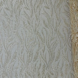 Fiesta Design Embroider and heavy beading on a mesh lace-sold by the yard. Nude/Clear main image 1