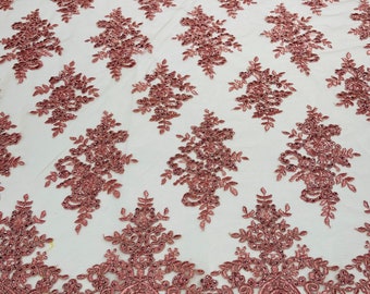 Dusty Rose corded flowers embroider with sequins on a mesh lace fabric-sold by the yard.