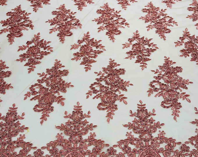 Dusty Rose corded flowers embroider with sequins on a mesh lace fabric-sold by the yard.