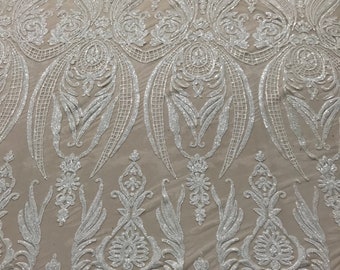White princess design embroidery with sequins on a nude 4 way Stretch Mesh-