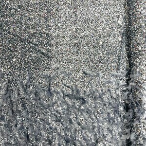 Silver 5mm sequins on a stretch velvet with feathers  2-way stretch, sold by the yard