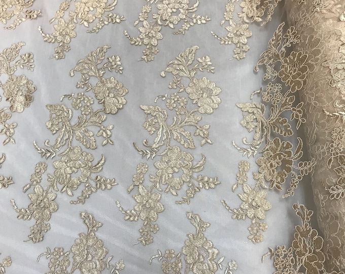 Champagne floral design embroider and corded on a mesh lace-sold by the yard.