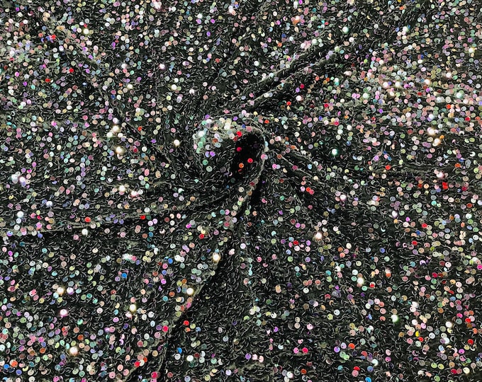 Black Iridescent economic all over shiny sequins on a 2 way stretch Black velvet , sold by the yard.