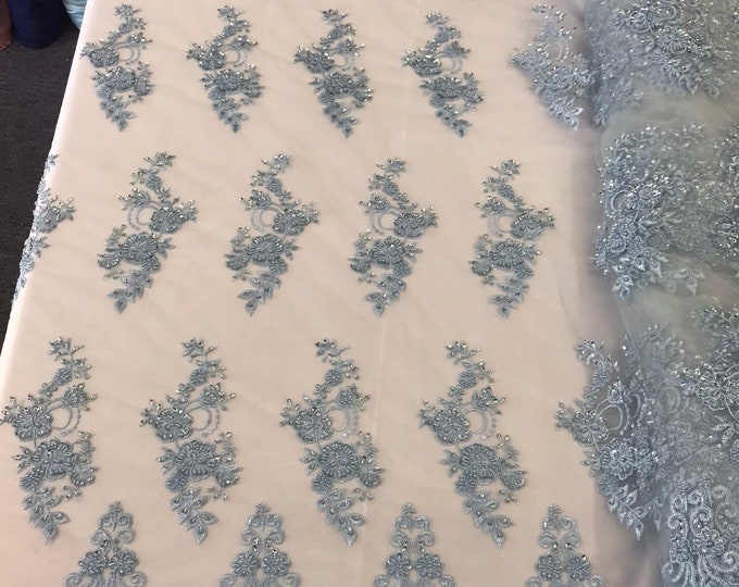 Light blue hand beaded floral design embroidery with shiny sequins on a mesh lace-dresses-fashion-prom-apparel-nightgown-sold by the yard.