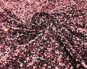 dusty rose 5mm sequins on a black stretch velvet 2-way stretch, sold by the yard.