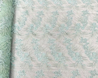 Mint feather design lace with metallic cord and embroider with sequins on a mesh-Sold by the yard.