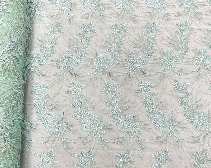 Mint feather design lace with metallic cord and embroider with sequins on a mesh-Sold by the yard.