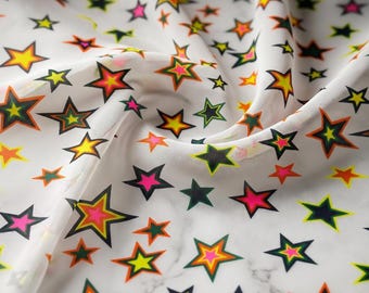 Multi color star design on a ivory power mesh 4-way stretch 58"-Sold by the yard