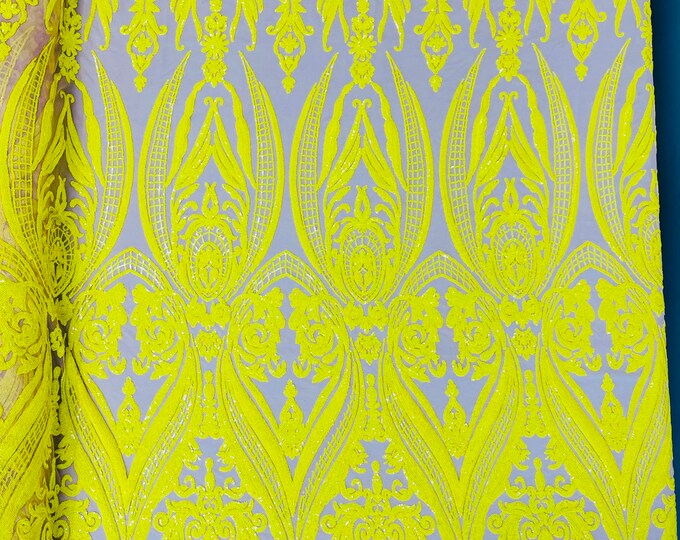 Bright yellow empire damask design with sequins embroider on a nude 4 way stretch mesh fabric-sold by the yard.