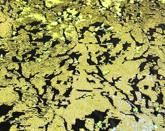 Neon Yellow iridescent sequins flip two tone camouflage  design on a black stretch velvet, Sold by the yard.