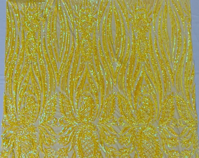 Yellow iridescent Paisley sequin design on a yellow 4 way stretch mesh-prom-sold by the yard.