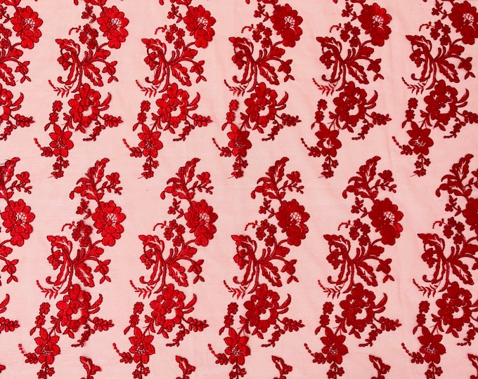 Red floral design embroider and corded on a mesh lace fabric-sold by the yard.