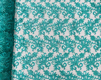 Teal green corded flowers embroider with sequins on a mesh lace fabric-sold by the yard-