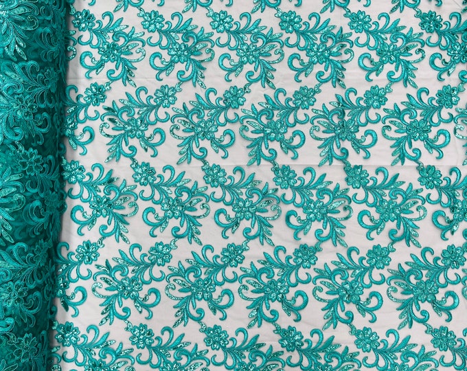 Teal green corded flowers embroider with sequins on a mesh lace fabric-sold by the yard-