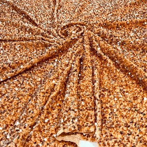 Rose gold 5mm sequins on a champagne stretch velvet 2-way stretch, sold by the yard.